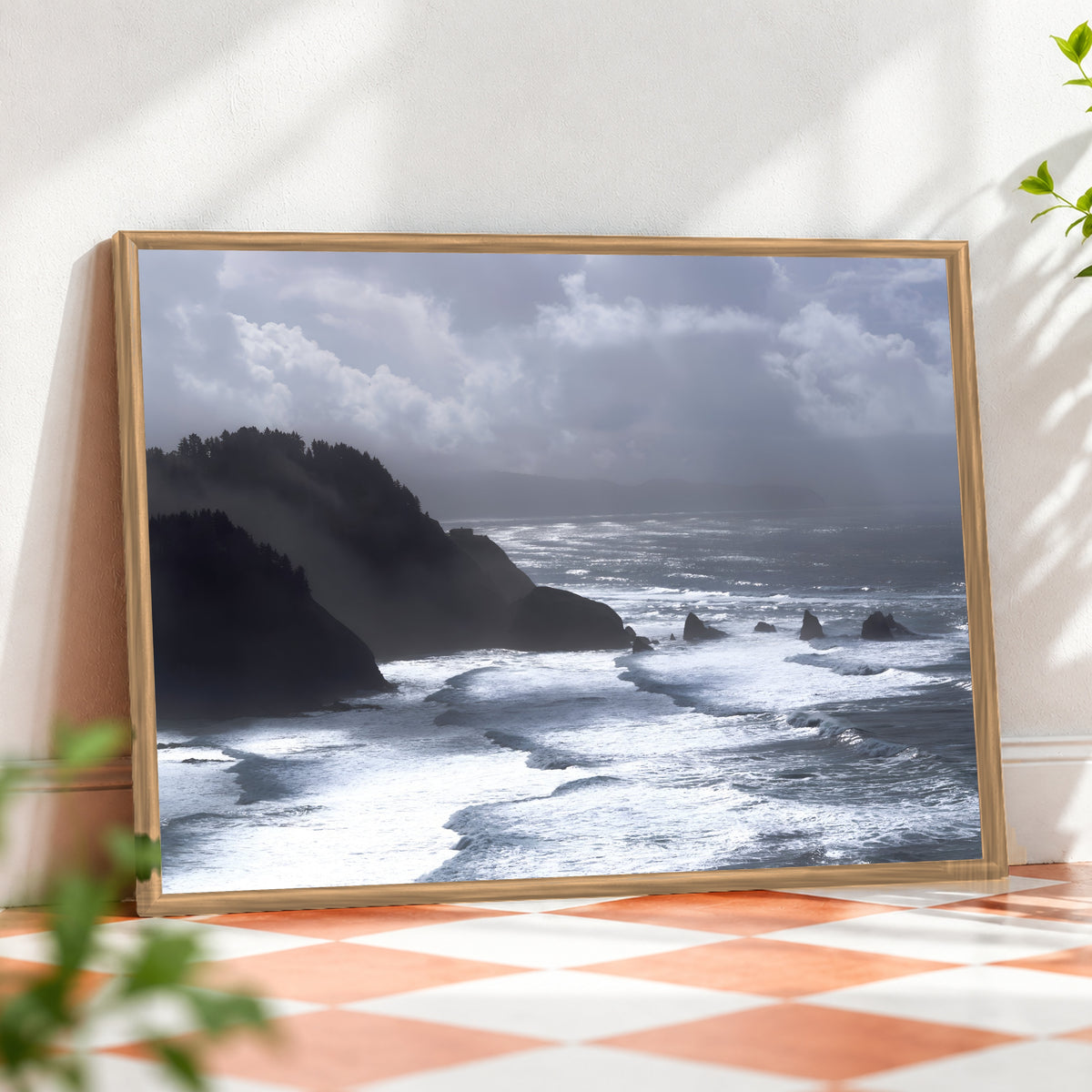 Framed ocean wall art featuring a coastal seascape photo by Humans Among Us, displayed in a wooden frame for home decor.